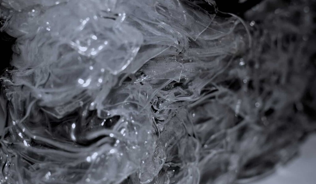 Abstract background of frozen surface with ice surface creating clean transparent shapeless texture
