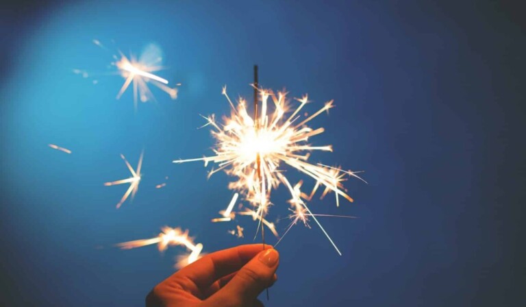 person holding sparkler